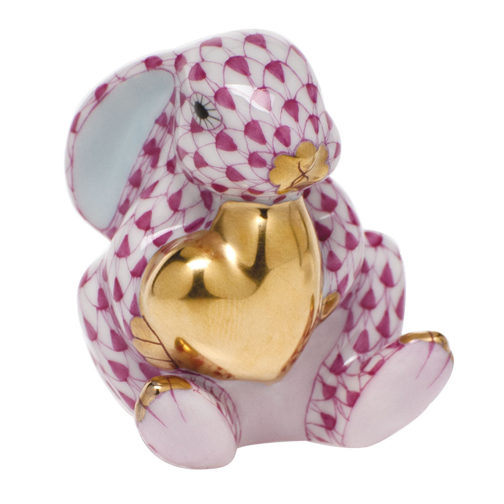 Hand-painted Herend Bunny with Heart Figurine in Raspberry fishnet porcelain on a white background