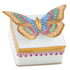 Hand-painted Herend Butterfly Box in Raspberry fishnet porcelain on a white background