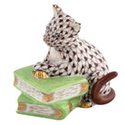 Hand-painted Herend Cat on Books Figurine in Chocolate fishnet porcelain on a white background