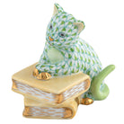 Hand-painted Herend Cat on Books Figurine in Key Lime fishnet porcelain on a white background