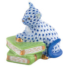 Herend Cat on Books figurine in Sapphire with deep sapphire blue fishnet pattern with gold accents on a white background