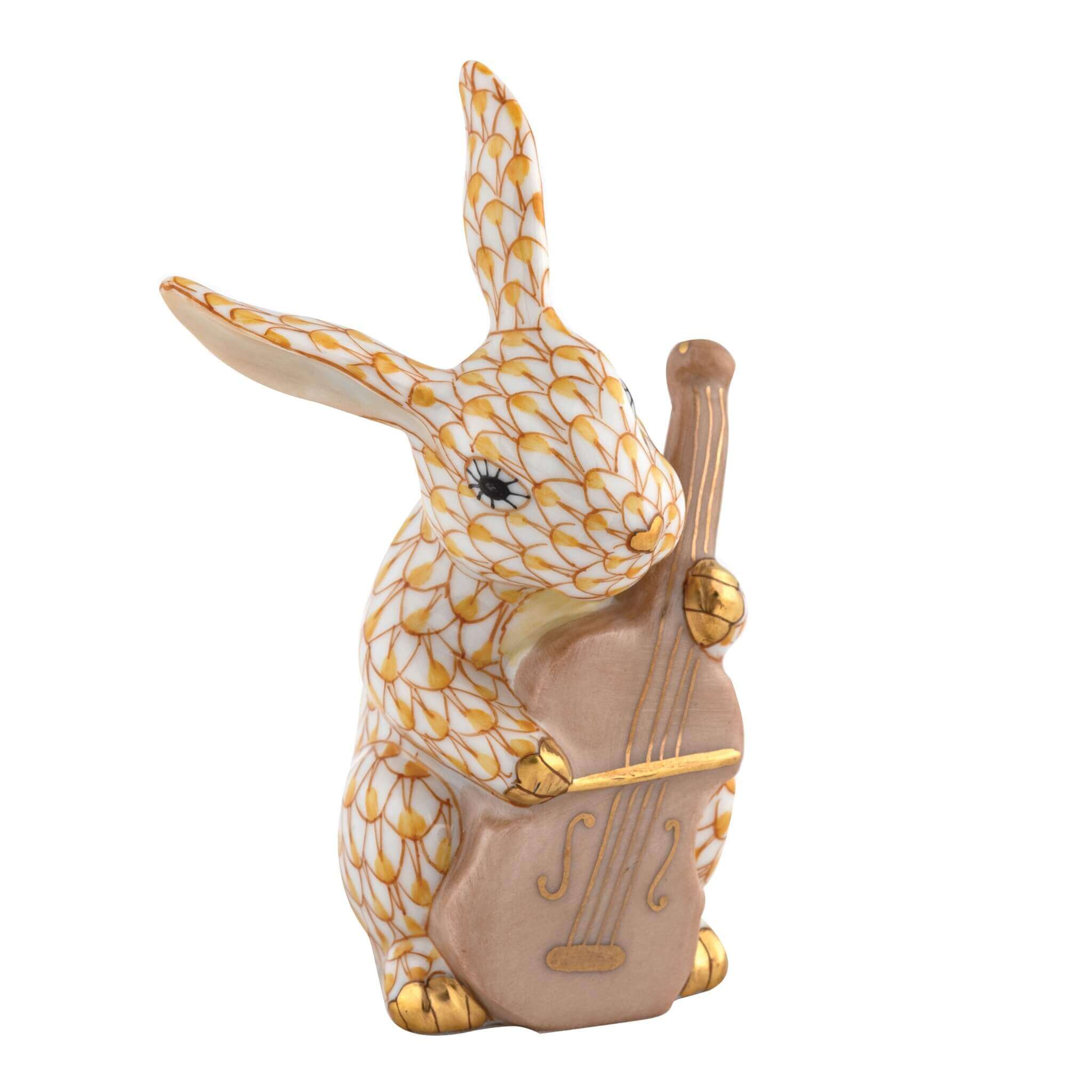 Herend Cello Bunny figurine in Butterscotch with warm butterscotch yellow fishnet pattern with gold accents on a white background