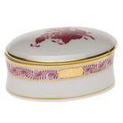 Hand-painted Herend Chinese Bouquet Raspberry Oval Box in fine porcelain, 2.75in L X 1.25in H, on a white background