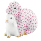 Herend Cuddling Bunnies figurine in Raspberry with raspberry pink fishnet pattern with gold accents on a white background