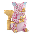 Hand-painted Herend Cupid Piggy Figurine in fine porcelain, 1.75in L X 1.25in W X 2in H, on a white background