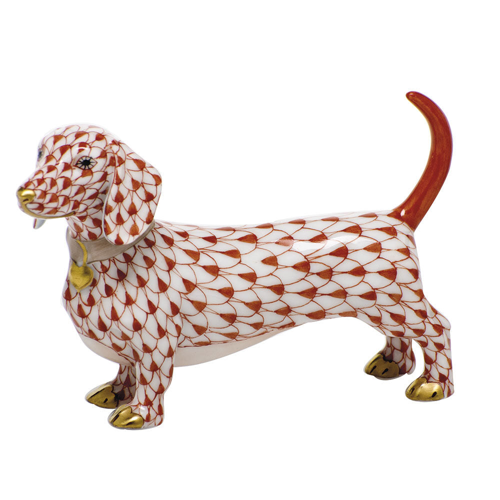 Hand-painted Herend Dachshund Figurine in Rust fishnet porcelain on a white background