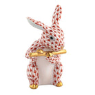 Herend Flute Bunny figurine in Rust with red-orange fishnet pattern with gold accents on a white background