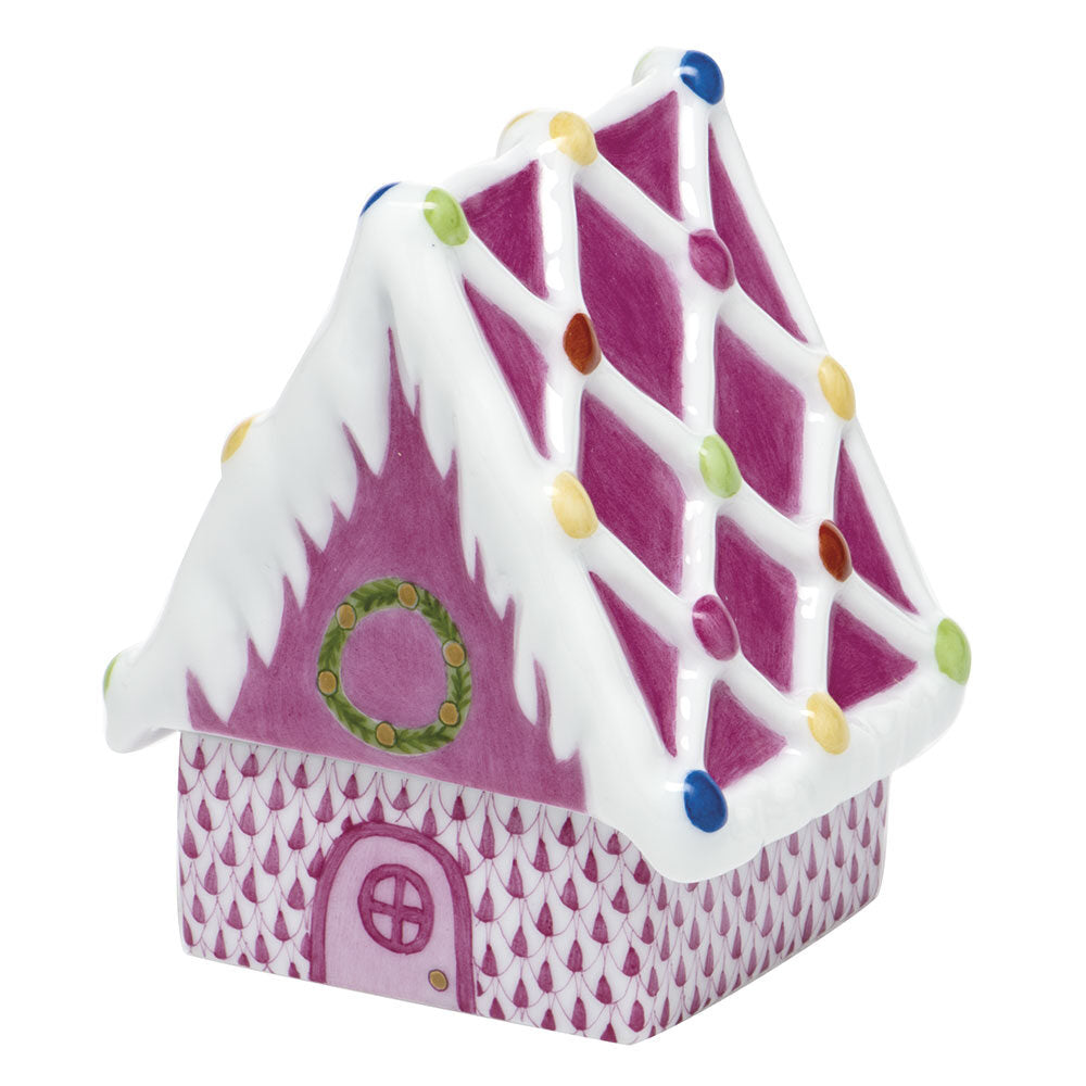 Hand-painted Herend Gingerbread House Figurine in Raspberry fishnet porcelain on a white background