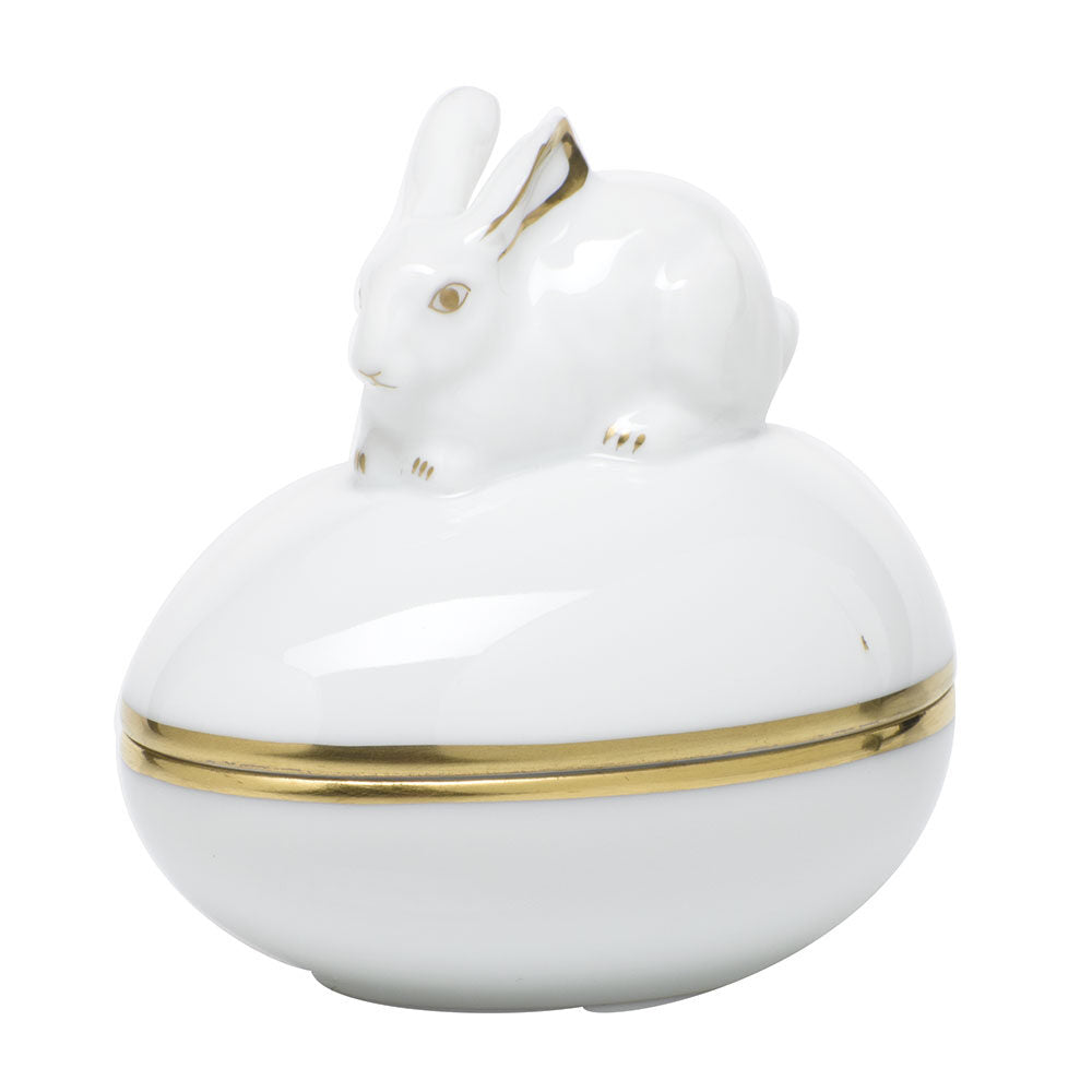 Hand-painted Herend Golden Edge Egg Bonbon with Bunny Candy Dish in fine porcelain, 3in L X 2.25in W X 3in H, on a white background