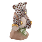 Hand-painted Herend Hiking Bear Figurine in Chocolate fishnet porcelain on a white background