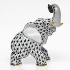 Hand-painted Herend Joyful Elephant Figurine in Black fishnet porcelain on a white background