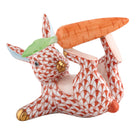 Hand-painted Herend Juggler Bunny Figurine in Rust fishnet porcelain on a white background