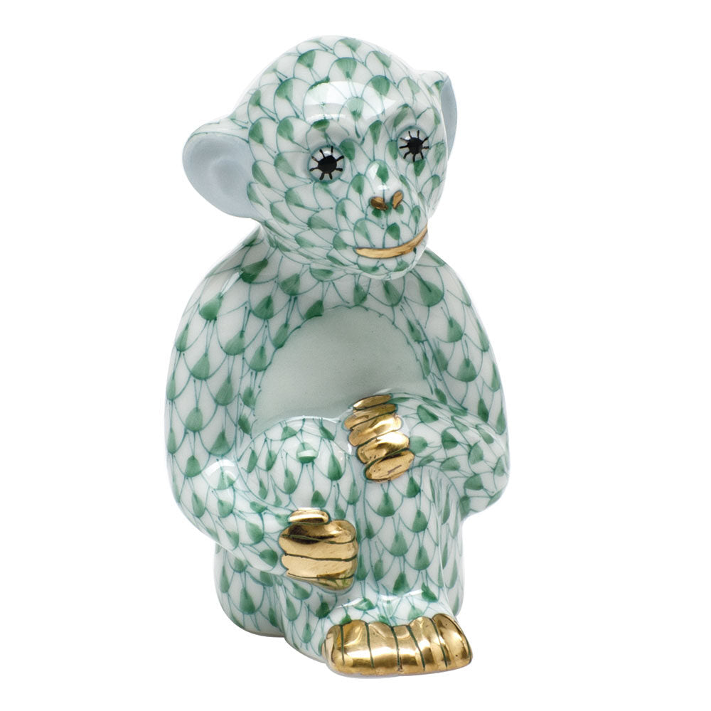 Hand-painted Herend Little Monkey Figurine in Green fishnet porcelain on a white background