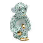 Hand-painted Herend Little Monkey Figurine in Green fishnet porcelain on a white background