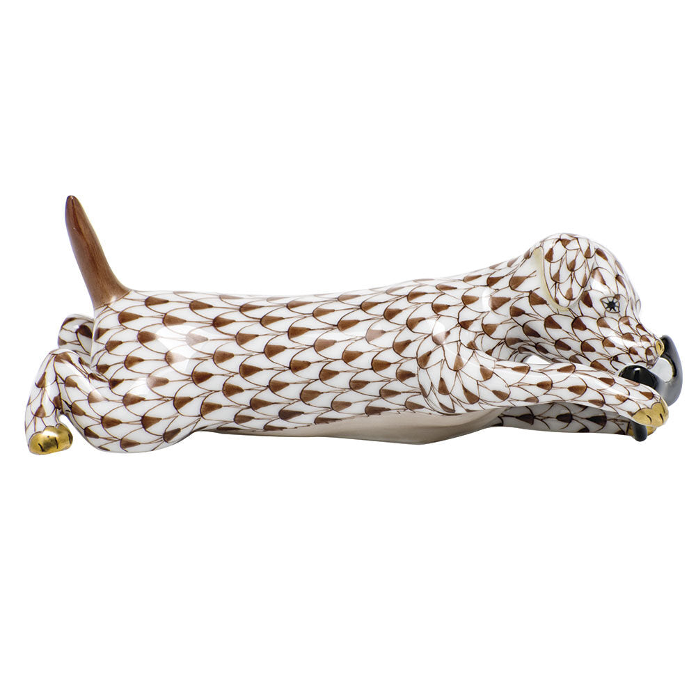 Hand-painted Herend Little Rascal Figurine in Chocolate fishnet porcelain on a white background