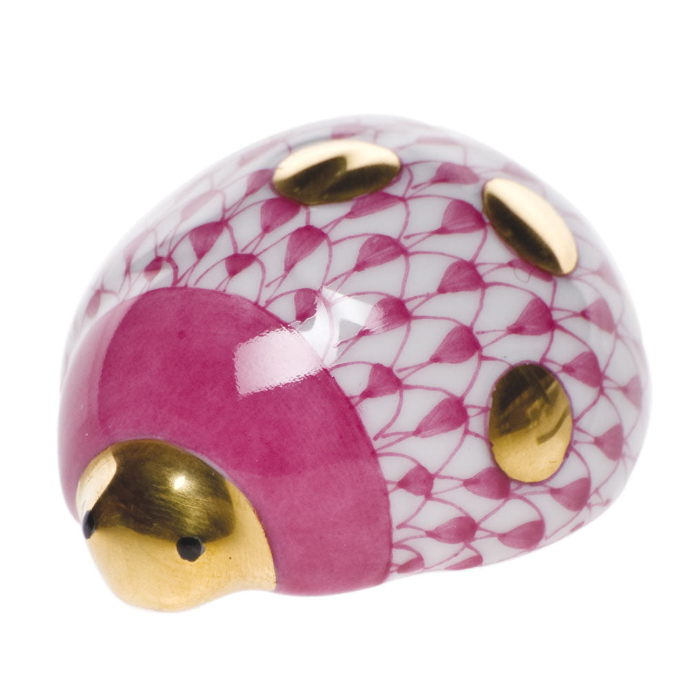 Hand-painted Herend Lucky Ladybug Figurine in Raspberry fishnet porcelain on a white background