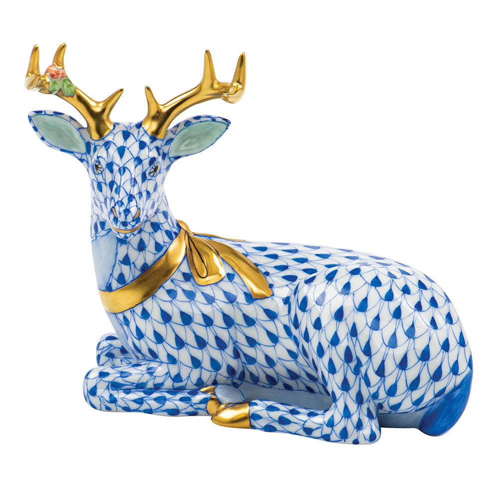 Hand-painted Herend Lying Christmas Deer Figurine in Sapphire fishnet porcelain on a white background
