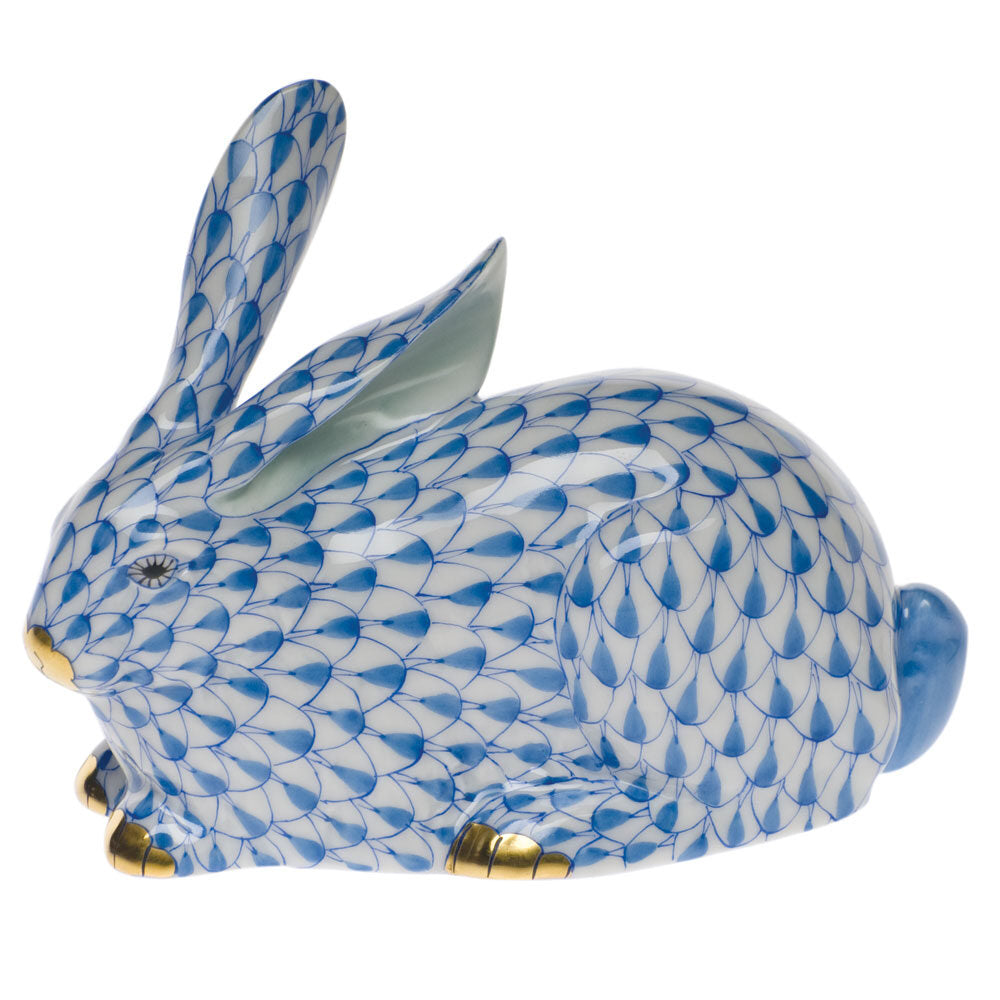 Hand-painted Herend Lying Rabbit Figurine in Blue fishnet porcelain on a white background