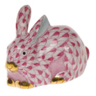 Hand-painted Herend Miniature Lying Rabbit Figurine in Raspberry fishnet porcelain on a white background