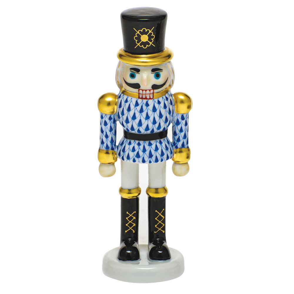 Hand-painted Herend Nutcracker Figurine in Sapphire fishnet porcelain on a white background