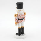 Herend Nutcracker with Christmas Tree Figurine – Rust, alternate view