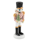Hand-painted Herend Nutcracker with Christmas Tree Figurine in Rust fishnet porcelain on a white background