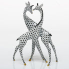 Hand-painted Herend Pair of Giraffes Figurine in Black fishnet porcelain on a white background