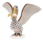 Hand-painted Herend Pelican with Fish Figurine in Chocolate-Butterscotch fishnet porcelain on a white background