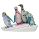 Hand-painted Herend Penguins on Ice Figurine in fine porcelain, 6in L X 5in H, on a white background