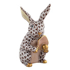 Hand-painted Herend Pickleball Bunny Figurine in Chocolate fishnet porcelain on a white background