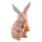 Hand-painted Herend Pickleball Bunny Figurine in Rust fishnet porcelain on a white background