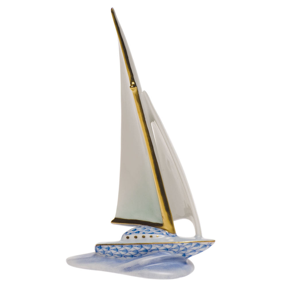Hand-painted Herend Sailboat Figurine in Blue fishnet porcelain on a white background