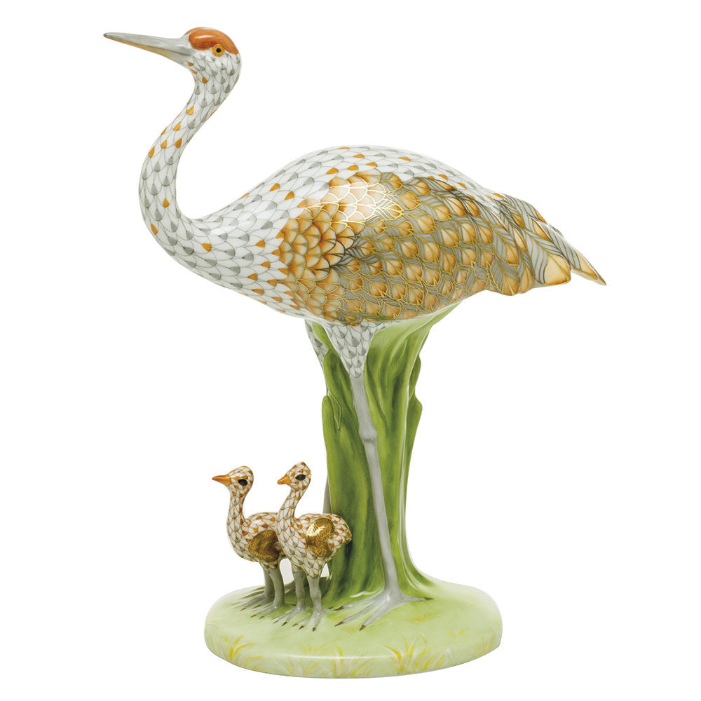 Hand-painted Herend Sandhill Crane and Babies Figurine in fine porcelain, 7in L X 3.75in W X 9.25in H, on a white background