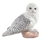 Hand-painted Herend Sitting Snowy Owl Figurine in fine porcelain, 7.75in L X 5.75in W X 7in H, on a white background