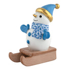 Herend Sledding Snowman figurine in Blue with blue fishnet pattern with gold accents on a white background