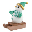 Herend Sledding Snowman figurine in Green with green fishnet pattern with gold accents on a white background