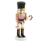 Hand-painted Herend Small Nutcracker W/Candy Cane Figurine in Rust fishnet porcelain on a white background