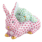 Hand-painted Herend Snuggle Bunnies Figurine in Raspberry-Key Lime fishnet porcelain on a white background