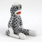 Herend Sock Monkey figurine in Black with black fishnet pattern with gold accents on a white background
