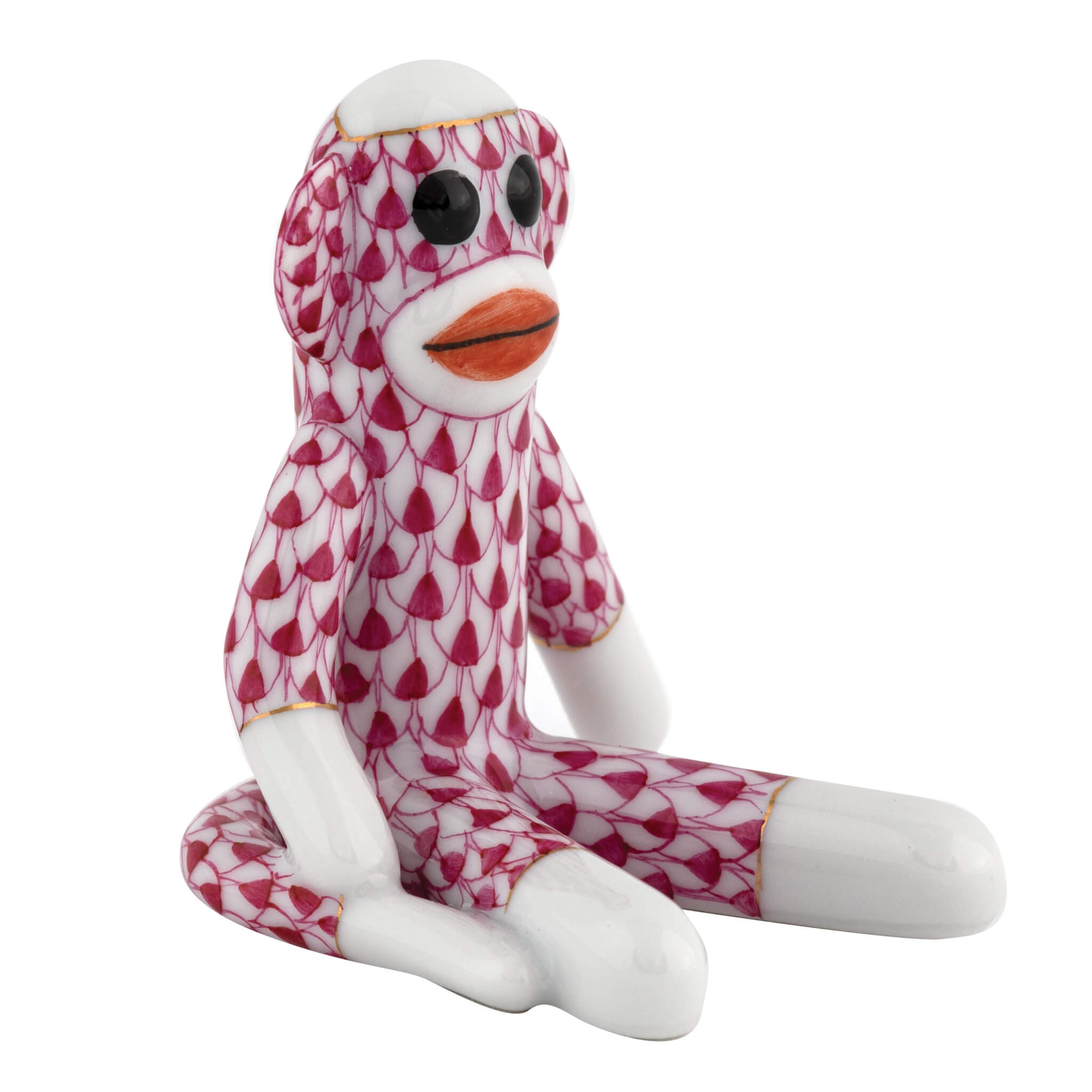 Herend Sock Monkey figurine in Raspberry with raspberry pink fishnet pattern with gold accents on a white background