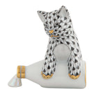 Hand-painted Herend Spilled Milk Figurine in Black fishnet porcelain on a white background