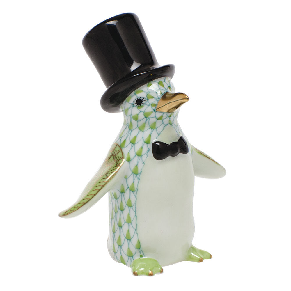 Hand-painted Herend Tuxedo Penguin Figurine in Key Lime fishnet porcelain on a white background