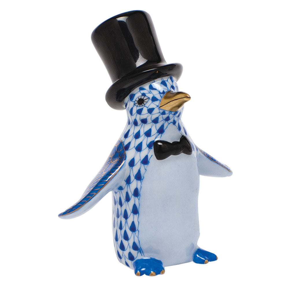 Hand-painted Herend Tuxedo Penguin Figurine in Sapphire fishnet porcelain on a white background