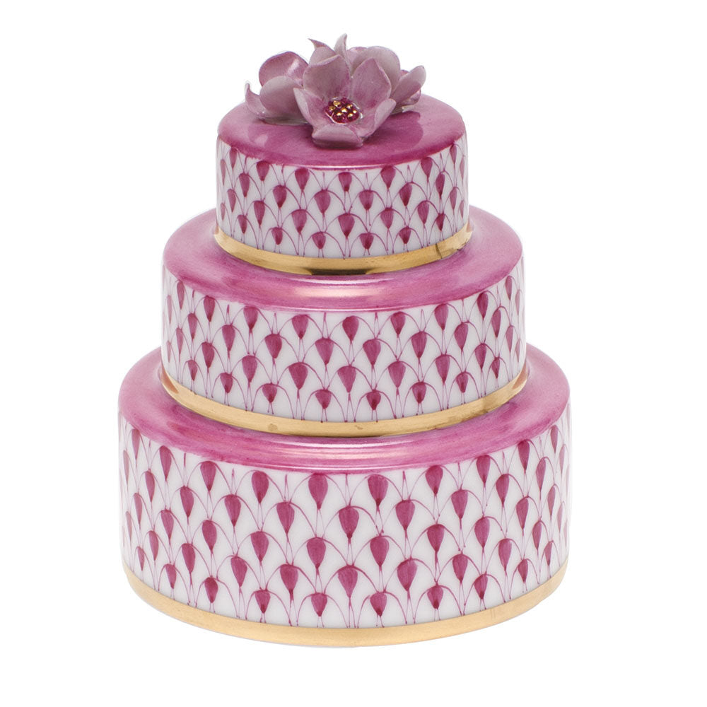 Hand-painted Herend Wedding Cake Figurine in Raspberry fishnet porcelain on a white background