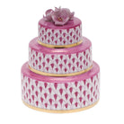Hand-painted Herend Wedding Cake Figurine in Raspberry fishnet porcelain on a white background
