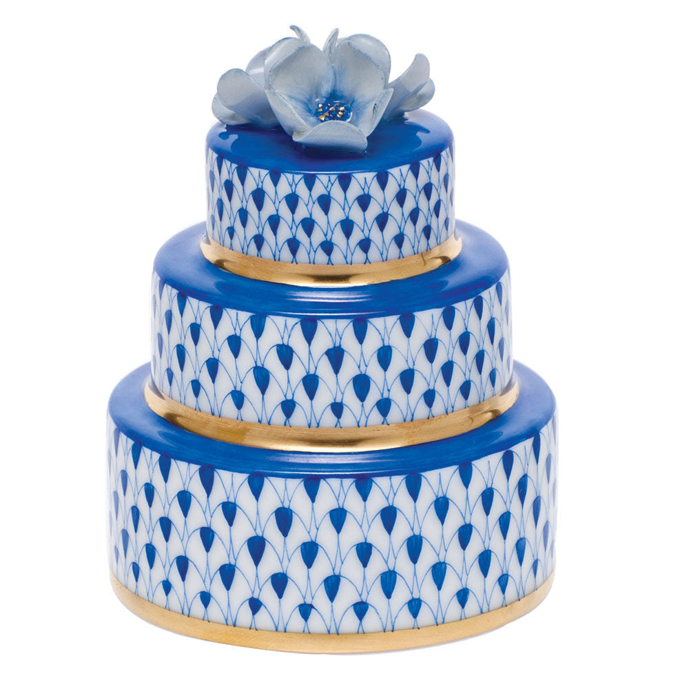 Hand-painted Herend Wedding Cake Figurine in Sapphire fishnet porcelain on a white background