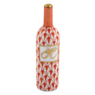 Herend Wine Bottle figurine in Rust with red-orange fishnet pattern with gold accents on a white background