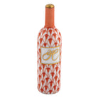 Hand-painted Herend Wine Bottle Figurine in Rust fishnet porcelain on a white background