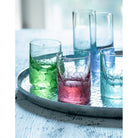 Moser Whisky Set Pebbles Shot Glasses 60 ml, Set of 6 Colors in a styled setting