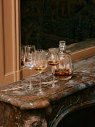 Saint-Louis Twist 1586 Fortified Wine Glasses, Set of 2 in a styled lifestyle setting